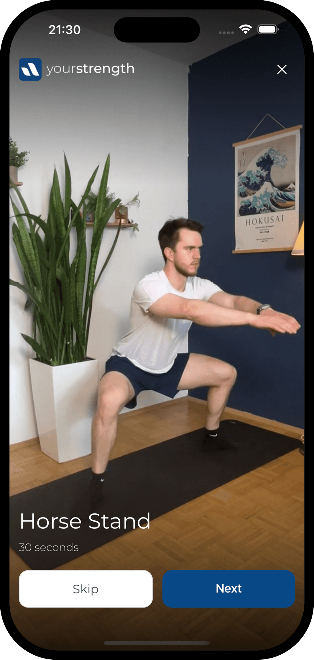 A guided exercise session in the app showing a coach demonstrating a horse stand